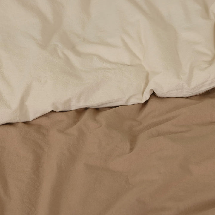 Reversible duvet cover showing both solid-color sides